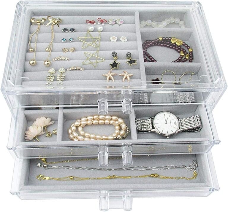 A clear jewelry box filled with jewelry and watches.