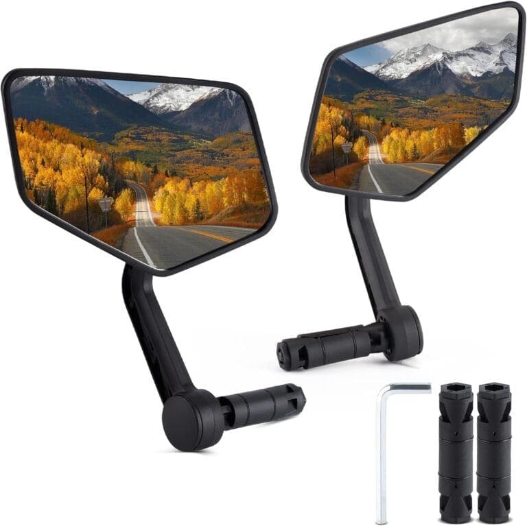 Two motorcycle side view mirrors with a mountain view.