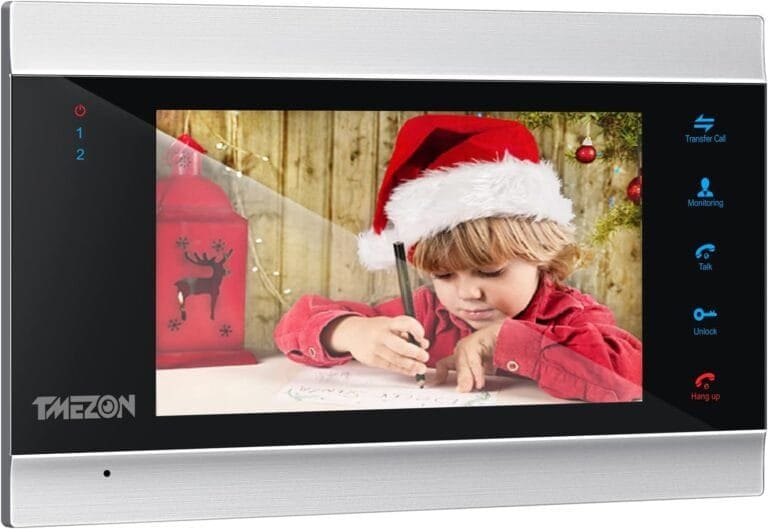 A child in a santa hat is holding a camera.